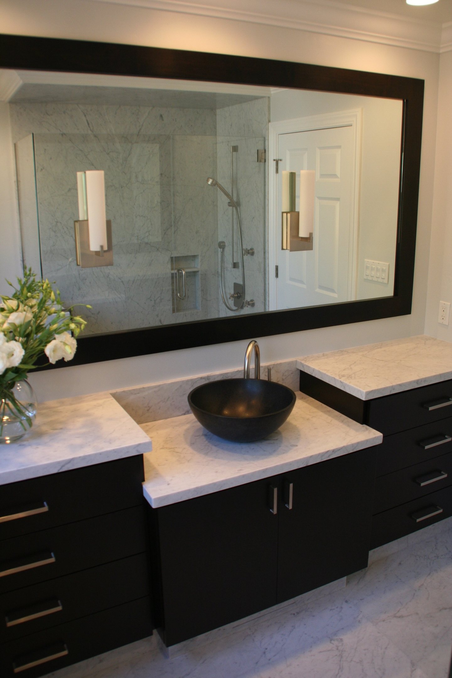 Ondyak — master bath — white stone vanity and black vessel sink — wide view in the bathroom