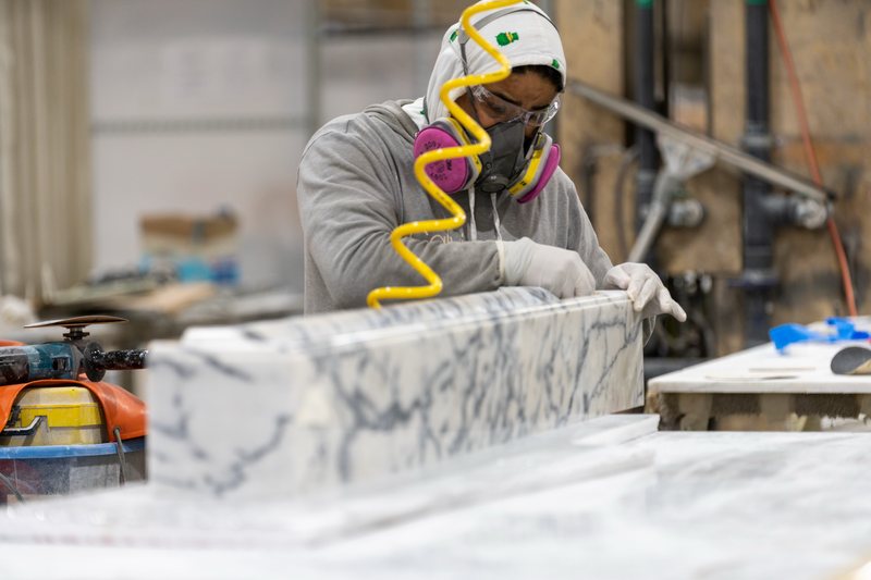 Hand-finishing a marble countertop