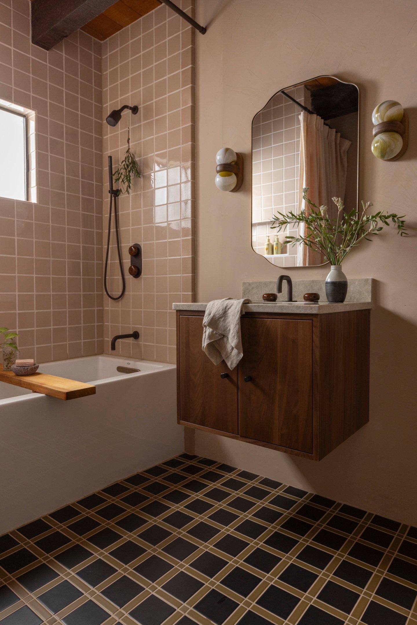 Warm tile bathroom with copper details
