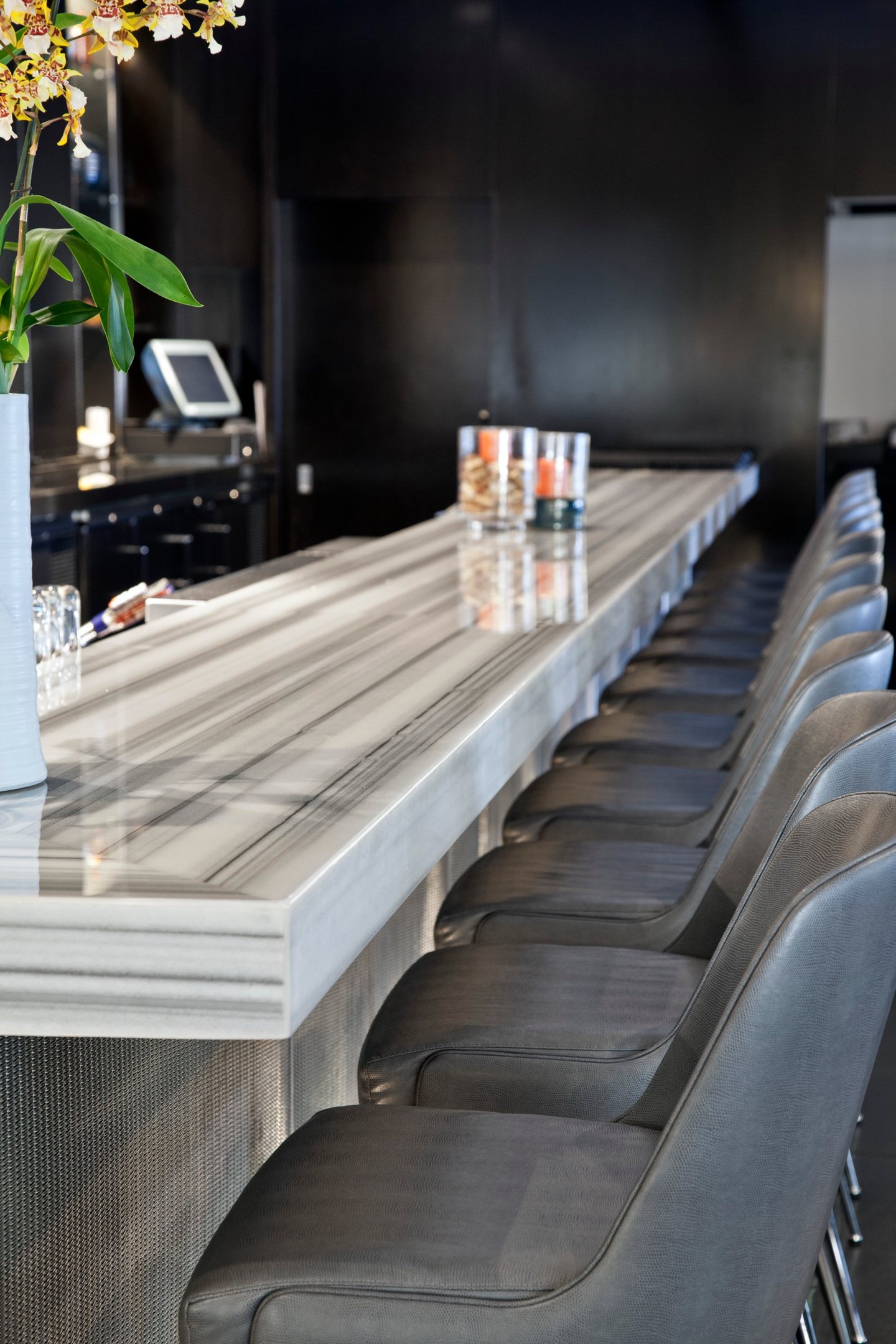 Le Meridien — striated stone bar and seating