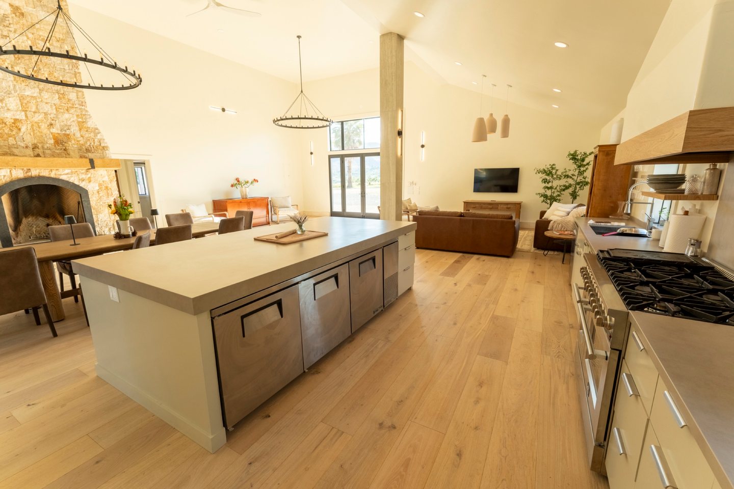 Casa Grande — open-plan stone kitchen and fireplace in the island