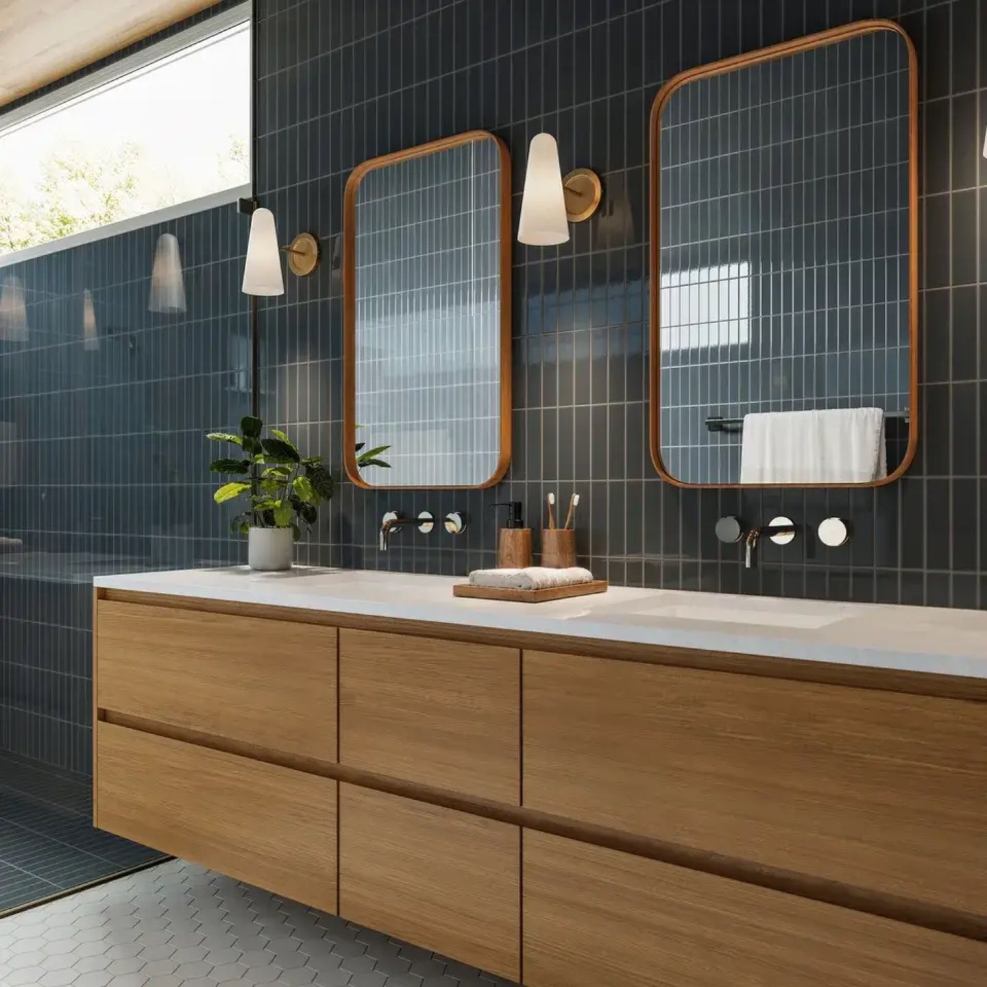 Dark ceramic tile bathroom with a floating wood vanity and patterned floor